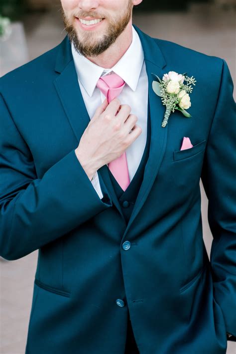 navy blue suit pink tie.